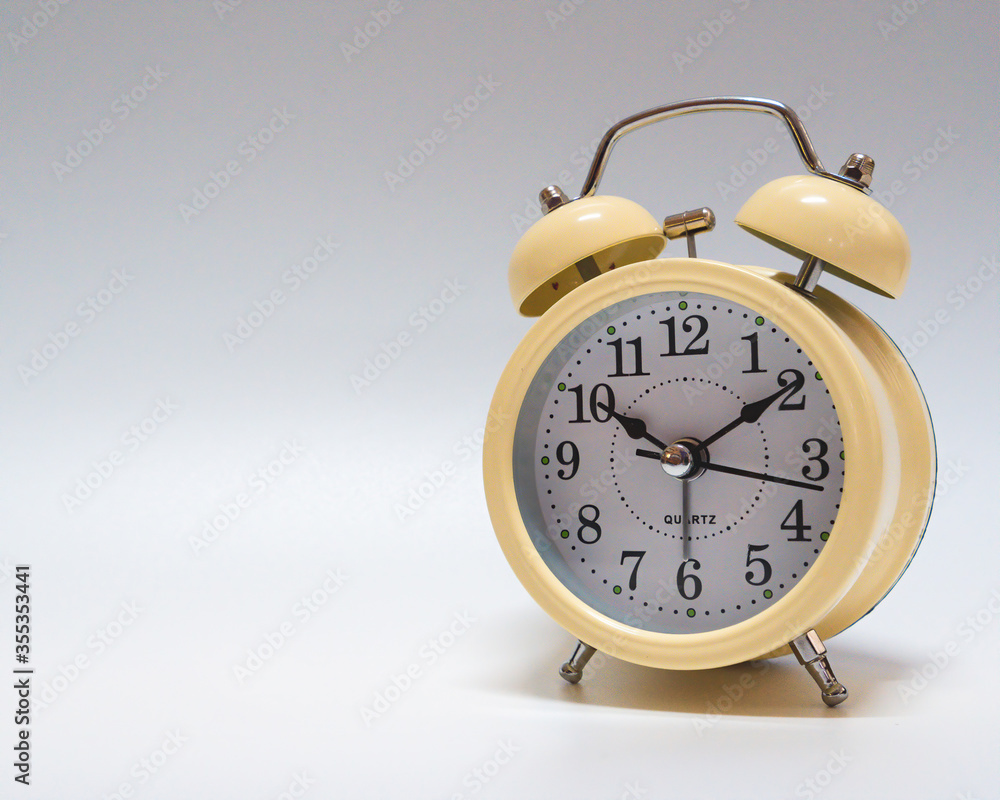 analog alarm clock on white background analog alarm clock on white background