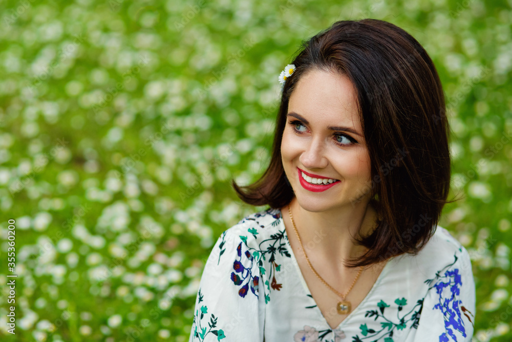 A beautiful woman enjoying a chamomile field, sitting in a meadow of flowers, a beautiful girl relaxing in the open air, having fun, holding a plant, a happy young lady and spring green nature A beautiful woman enjoying a chamomile field, sitting in a meadow of flowers, a beautiful girl relaxing in the open air, having fun, holding a plant, a happy young lady and spring green nature