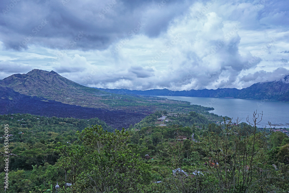 Magnificent nature view of Mount Batur and Batur lake in Kintamani, Bali. Mount Batur is a active volcano as the latest eruption was in year 2000.