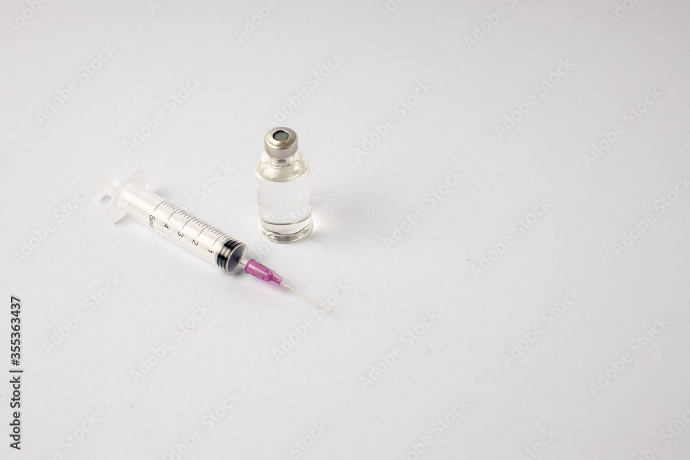 syringe, vaccine, lying on a white background syringe, vaccine, lying on a white background