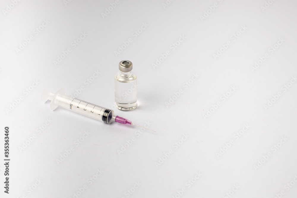 syringe, vaccine, lying on a white background syringe, vaccine, lying on a white background