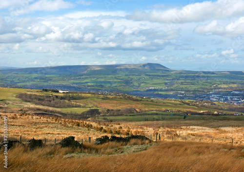 Fototapeta Moorland scene in Lancashire, north-east England, with Burnley town and Pendle H