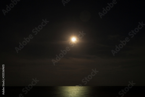 moon over the sea © navin