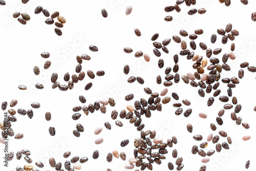Small group of chia seeds isolated on white background. Closeup. Top view. Chia super food.