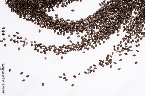 Abstract group of chia seeds isolated on white background. Closeup. Top view. Chia super food.
