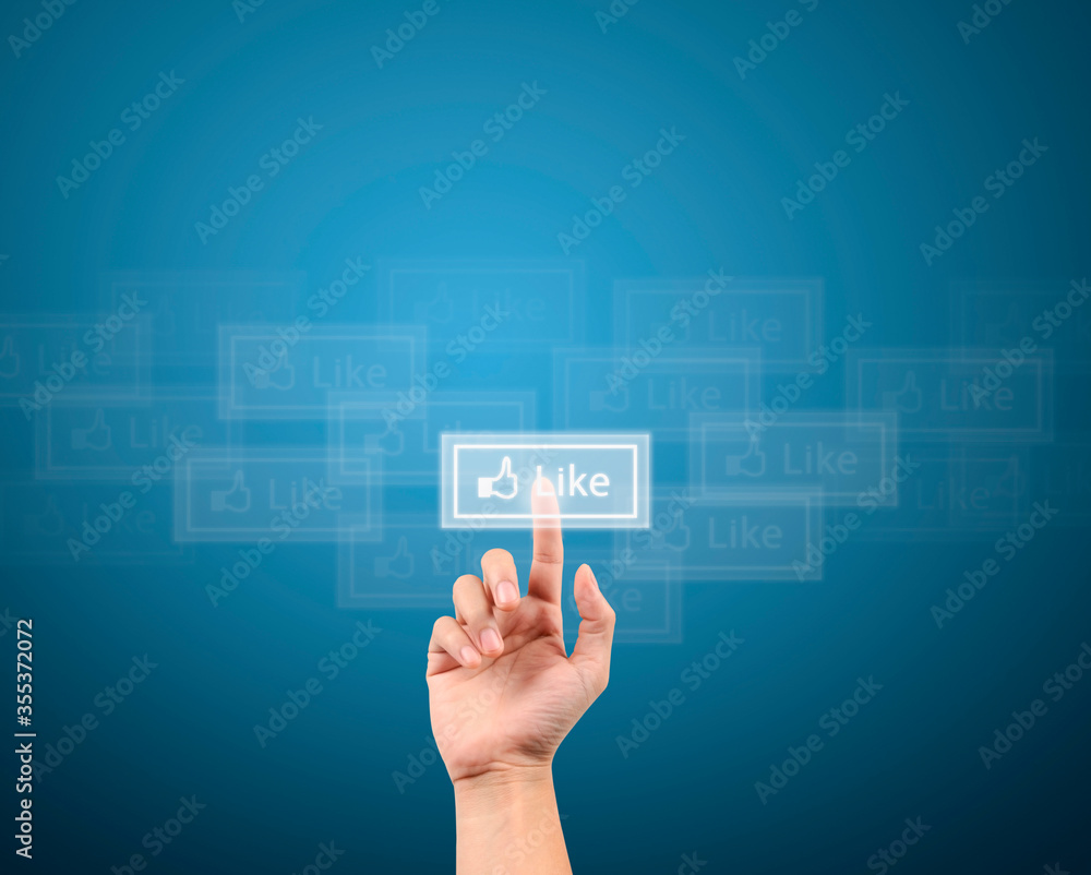 hand pushing like button on a touch screen interface hand pushing like button on a touch screen interface