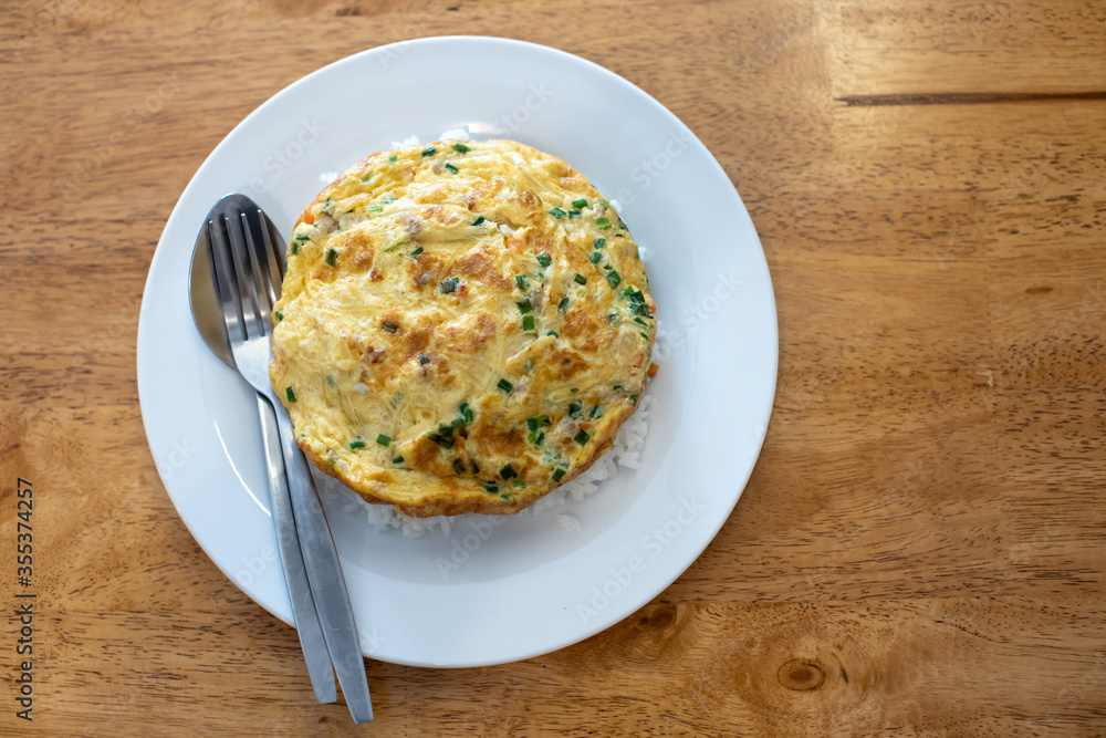 Omelette on top until white, with spoon and fork. Omelette on top until white, with spoon and fork.