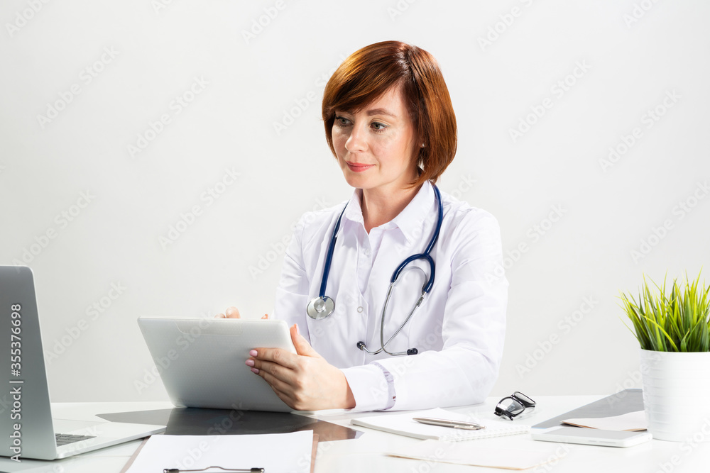Beautiful doctor using tablet computer Beautiful doctor using tablet computer