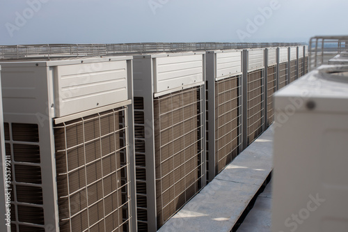 Large air conditioners arranged on top of tall buildings of the factory hospital