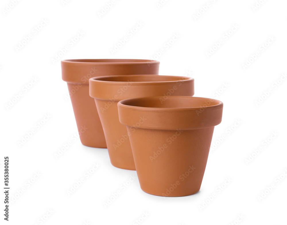 Stylish terracotta flower pots isolated on white Stylish terracotta flower pots isolated on white