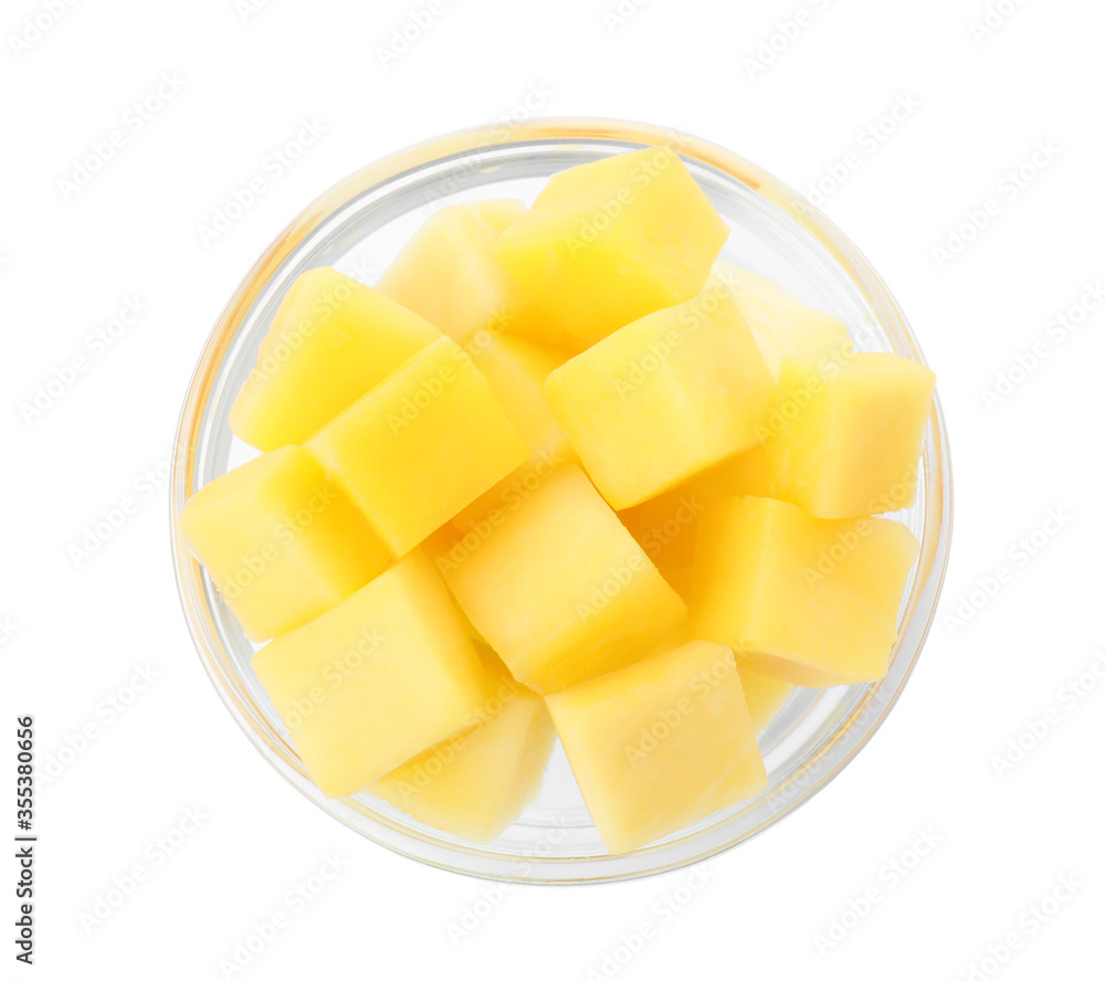 Tasty mango cubes in glass bowl isolated on white, top view