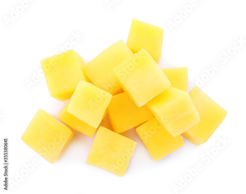 Tasty ripe mango cubes isolated on white, top view
