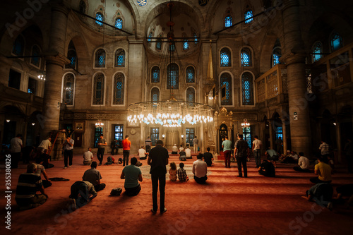 Eyup Sultan Mausoleum Mosque interior view. Many people praying. islam © Daniel Carpio