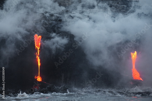 Hawaii. Volcano eruption. Hot lava flows into the waters of the Pacific Ocean.