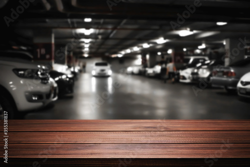 Empty desk platform over car park background. For product display montage. © qOppi