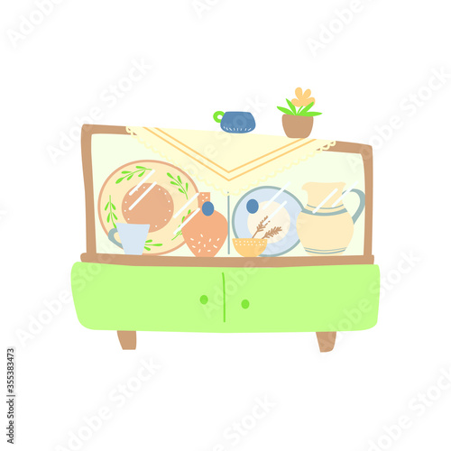 An antique cabinet with glass doors filled with home utensils. An outdated cute furniture. Fireside comfort