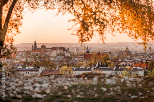 Krakow skyline during the sunset as it can be seen from Krakus Mound. photo