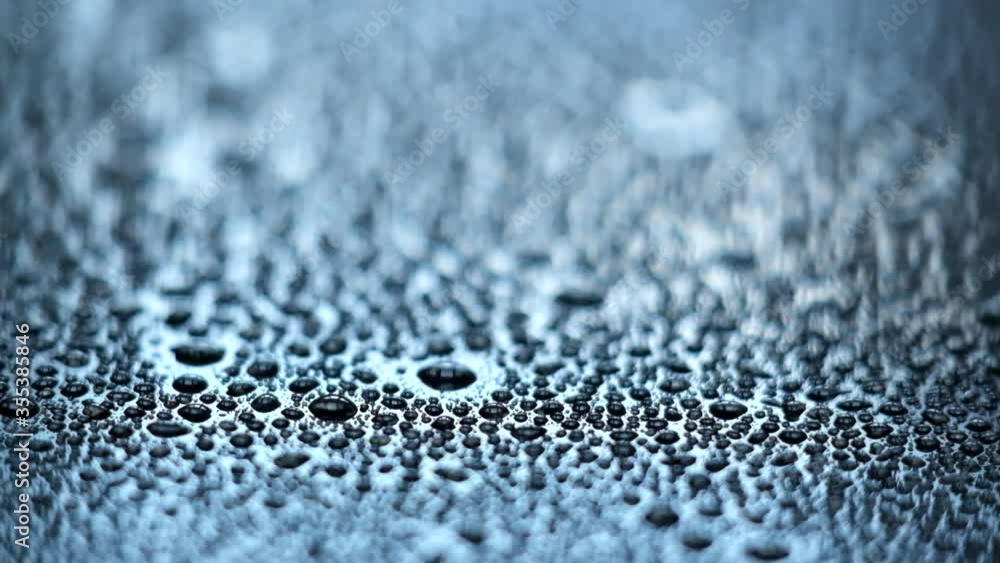 Droplets falling on a shiny surface, shallow depth of field view. Droplets falling on a shiny surface, shallow depth of field view.