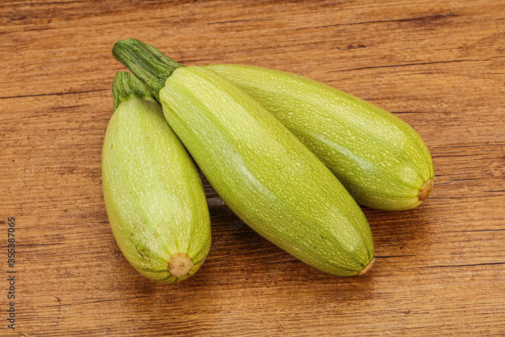 Young tasty zucchini over board Young tasty zucchini over board