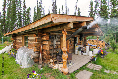 Yukon river, Yukon Territory, Alaska, USA. Wooden cabin in the remote wilderness of Alaska.