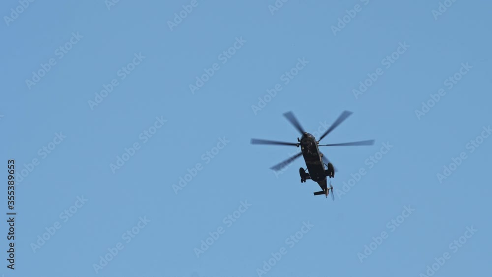 military helicopter flying up above under clear sky military helicopter flying up above under clear sky