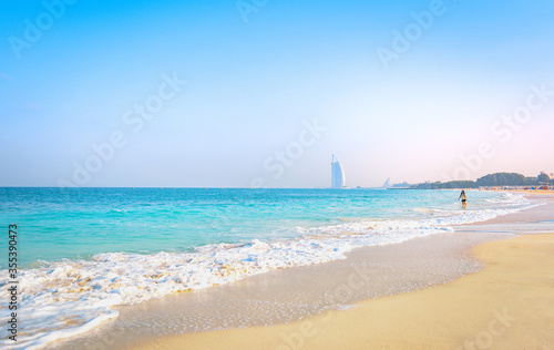 Photography Beautiful landscape of Al Sufouh Beach, one of Dubai's hidden gems, also known as “Secret Beach and Black Palace Beach with iconic Burj Al Arab in the background