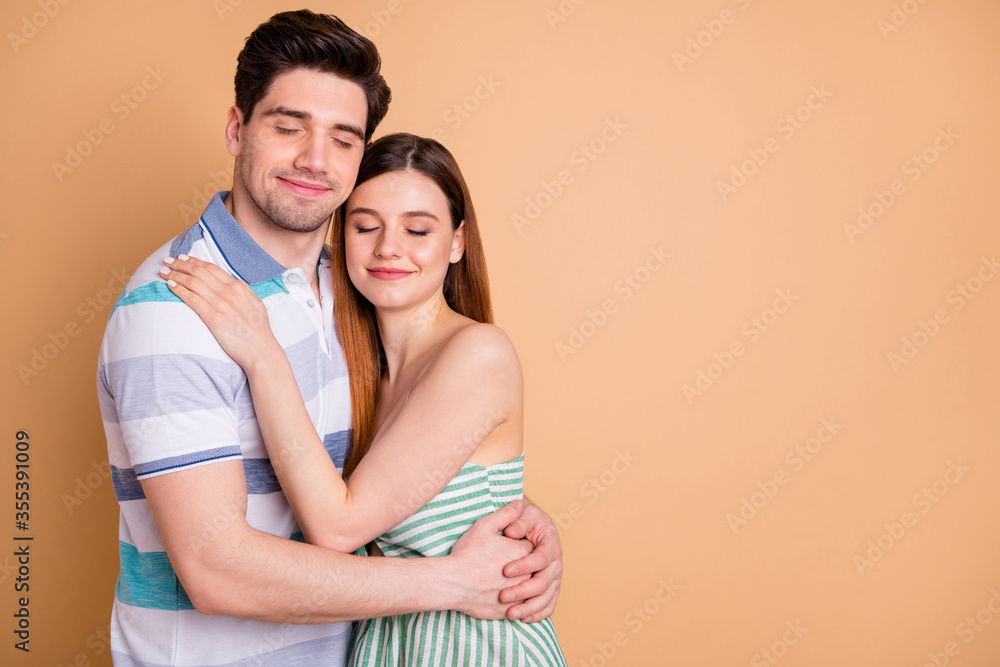Portrait of passionate married couple man woman hug embrace cuddle copyspace enjoy togetherness close eyes wear good look skirt isolated over pastel color background Portrait of passionate married couple man woman hug embrace cuddle copyspace enjoy togetherness close eyes wear good look skirt isolated over pastel color background