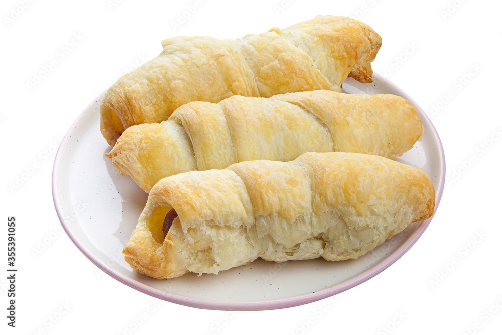 Crispy pies sausages on a plate on White background Crispy pies sausages on a plate on White background