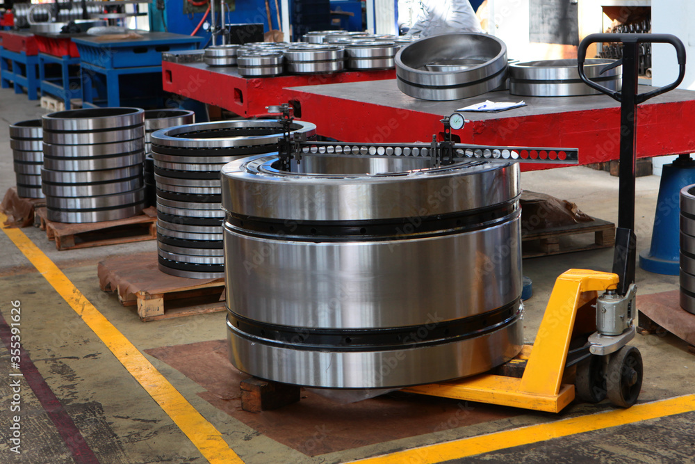 Ready-made bearings of large diameter. Heavy industry concept. Photos at the factory. Signal lines on the floor of the plant. Ready-made bearings of large diameter. Heavy industry concept. Photos at the factory. Signal lines on the floor of the plant.