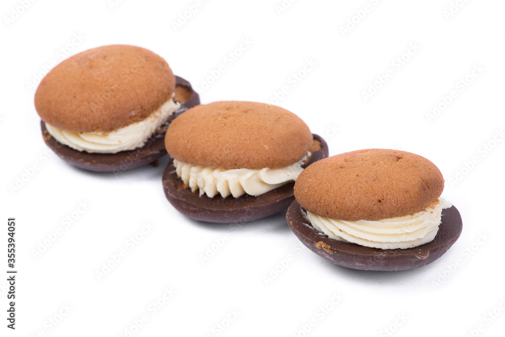 Three pastry biscuit sandwich with chocolate