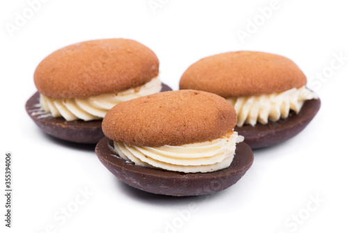 Three pastry biscuit sandwich with chocolate isolated