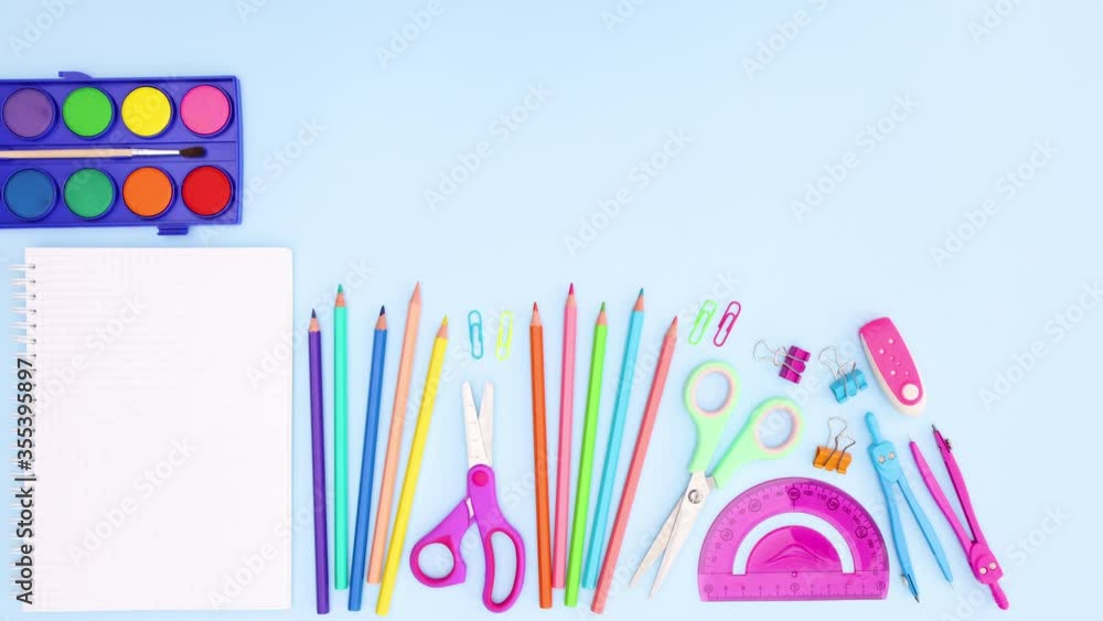 Back to school concept. School tools and notebook appear on pastel pink background - Stop motion Back to school concept. School tools and notebook appear on pastel pink background - Stop motion