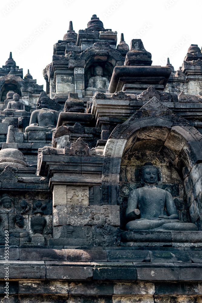 Fototapeta premium Statues and Stupas of the Borobudur Temple, West Java, Indonesia (750AD)