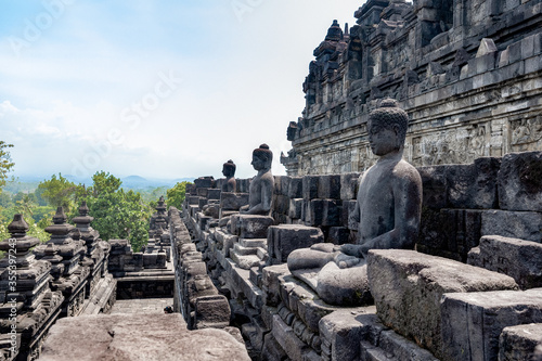 Statues and Stupas of the Borobudur Temple, West Java, Indonesia (750AD) photo