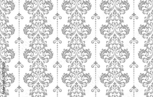 Wallpaper in the style of Baroque. Seamless vector background. White and grey floral ornament. Graphic pattern for fabric, wallpaper, packaging. Ornate Damask flower ornament.
