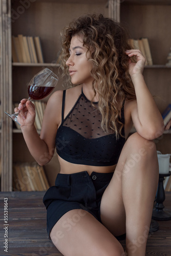 beautiful lovely girl with spots Vitiligo in her arms with a glass of wine