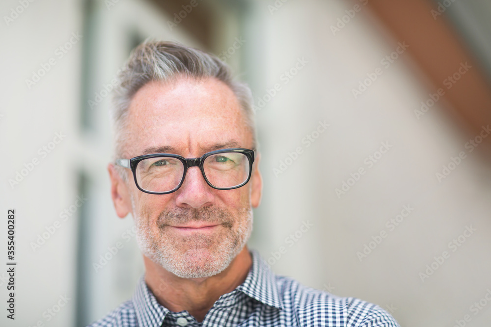 Mature handome fit man sitting outside stock photo Mature handome fit man sitting outside stock photo