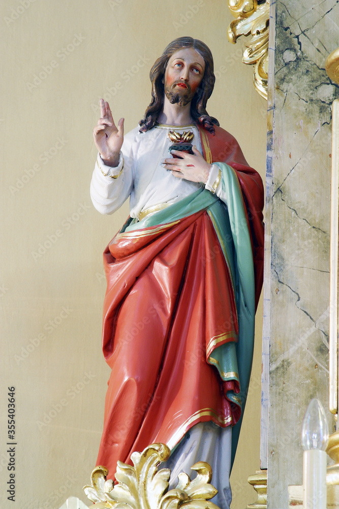 Fototapeta premium Sacred Heart of Jesus, statue on the altar Our Lady of Sorrows in the parish church of Saints Peter and Paul in Kasina, Croatia
