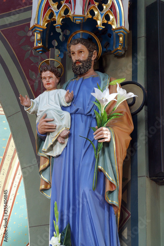 Saint Joseph holds the baby Jesus statue in the parish church of the Nativity of the Virgin Mary in Granesina, Croatia