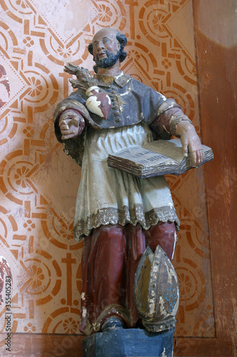 St. Charles Borromeo statue on the altar of St. Anthony the Hermit at the Church of the Visitation of the Virgin Mary in Stari Farkasic, Croatia photo