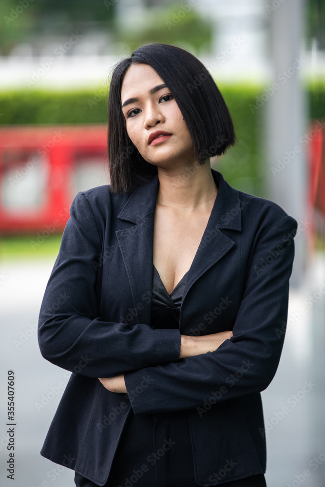 Fashion portrait of young beautiful woman sexy outdoor. black suit, standing on blur urban background. Fashion portrait of young beautiful woman sexy outdoor. black suit, standing on blur urban background.