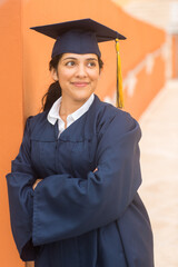 Young hispanic female graduate at her graduation