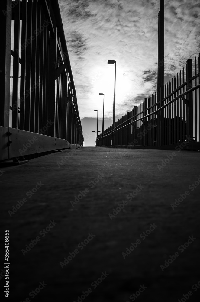 Black and white photo of a walk way Black and white photo of a walk way