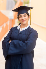 Young hispanic female graduate at her graduation