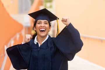 Young hispanic female graduate at her graduation