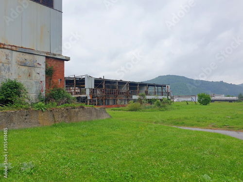 POTOCARI, SREBRENICA, BOSNIA AND HERZEGOVINA - June 01 2020: The place where murdered men and young boys in Potocari, victims of Srebrenica genocide and factory where prisioners were. photo