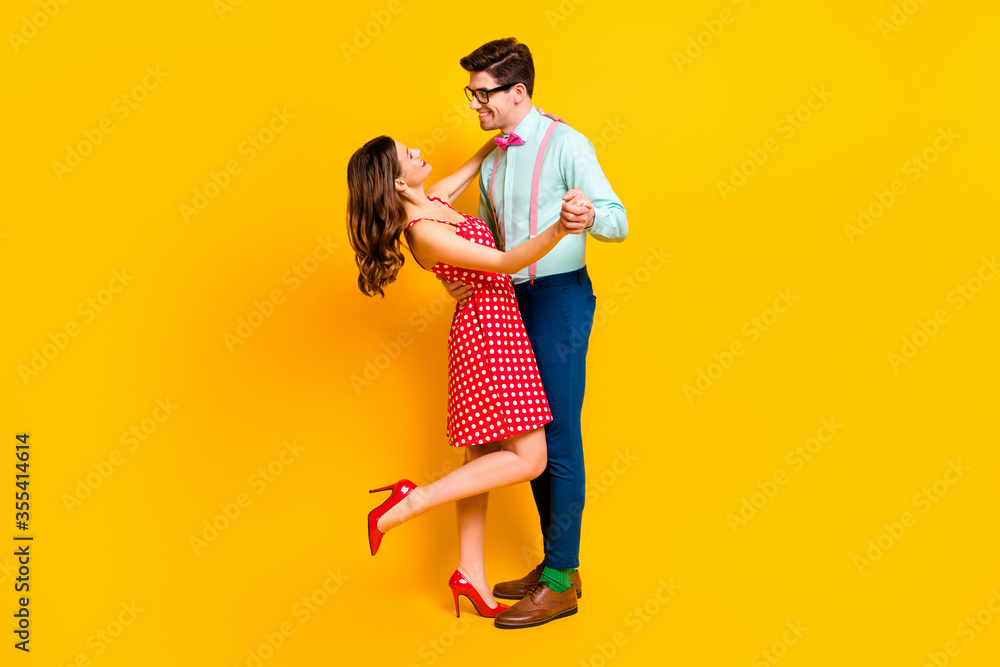 Full length photo positive tender gentle student two people dance graduation event party wear red dotted dress mini short legs high-heels suspenders isolated bright shine color background Full length photo positive tender gentle student two people dance graduation event party wear red dotted dress mini short legs high-heels suspenders isolated bright shine color background