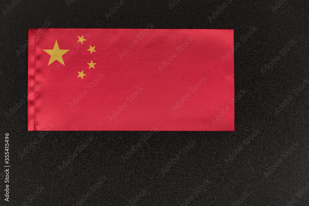 Flag of Peoples Republic of China on black background. National symbol
