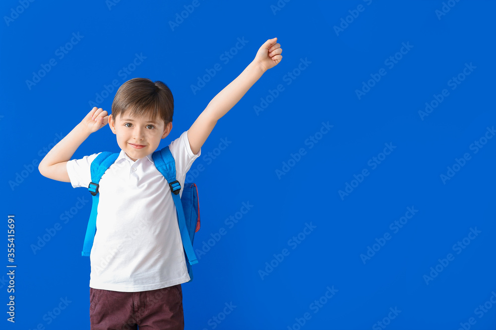 Cute little schoolboy on color background Cute little schoolboy on color background