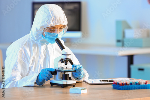 Scientist working with micr...